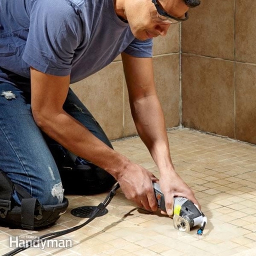 1. If you're trying to remove grout from your tile, you may be wondering whether you should use a razor blade or a scraper.