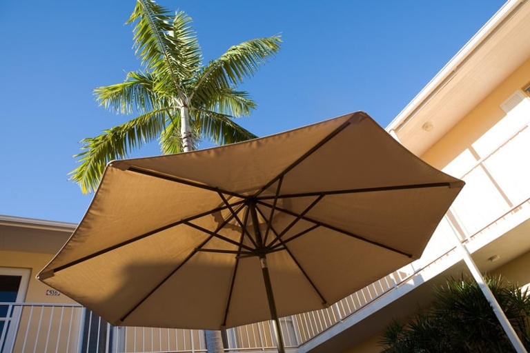 6. Use a door stop to keep your patio umbrella from spinning.
