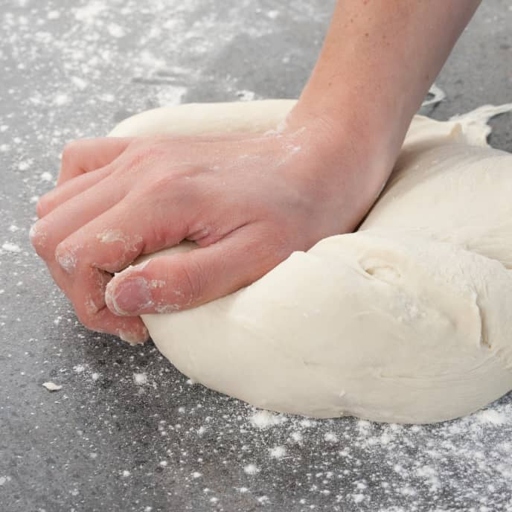 8. Knead Well - Kneading the dough is key to making soft, fluffy bread.