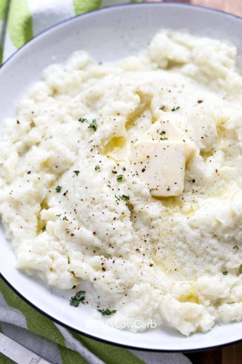 Adding cream cheese to mashed cauliflower is an easy way to thicken it.