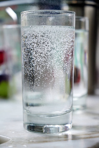 Carbonated water is water that has been infused with carbon dioxide gas under pressure. When water is frozen, it expands and the carbon dioxide is released, leaving behind flat, flavorless water.
