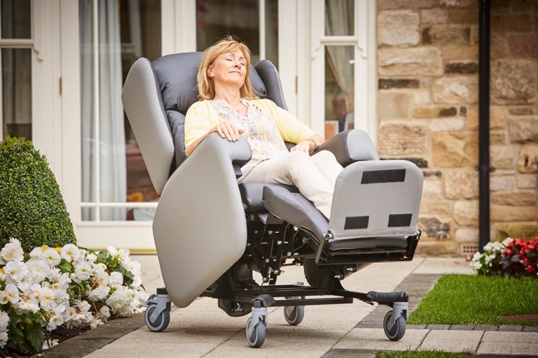 If an elderly person is sliding out of a chair, they can use footplates to help keep them in the chair.