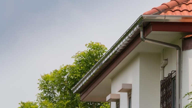 If you have water standing in your gutters, it's likely because your gutters are sagging.