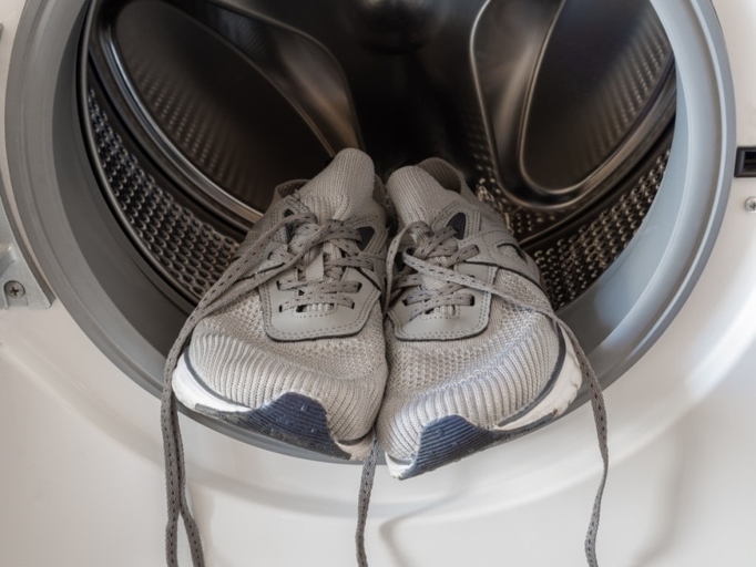 If you're in a hurry and need to dry your shoes quickly, you can put them in the dryer on a low or no heat setting.