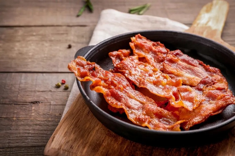 If you're looking to keep your bacon warm and fresh, using a slow cooker is a great option.