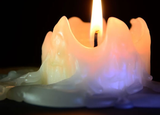 If you're trying to remove candle wax from a surface, you can use either acetone or isopropyl alcohol.