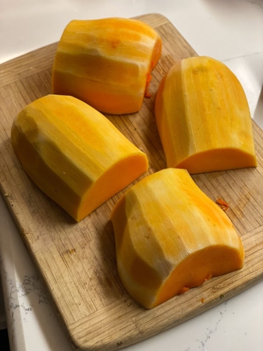 Next, use a spoon to scoop out the flesh, being careful not to include the seeds. Finally, cut the flesh into desired pieces and enjoy! To prepare jackfruit, first cut off the stem, then cut the fruit in half lengthwise.