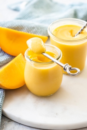 One delicious way to use overripe mangoes is to make mango ice-cubes! Simply cut up the mangoes and put them in an ice-cube tray with a little bit of water. Once they're frozen, you can add them to your favorite drinks for a delicious and refreshing treat.