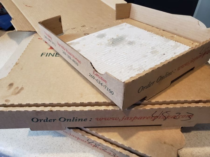 Pizza boxes are made from corrugated cardboard, which is compostable.
