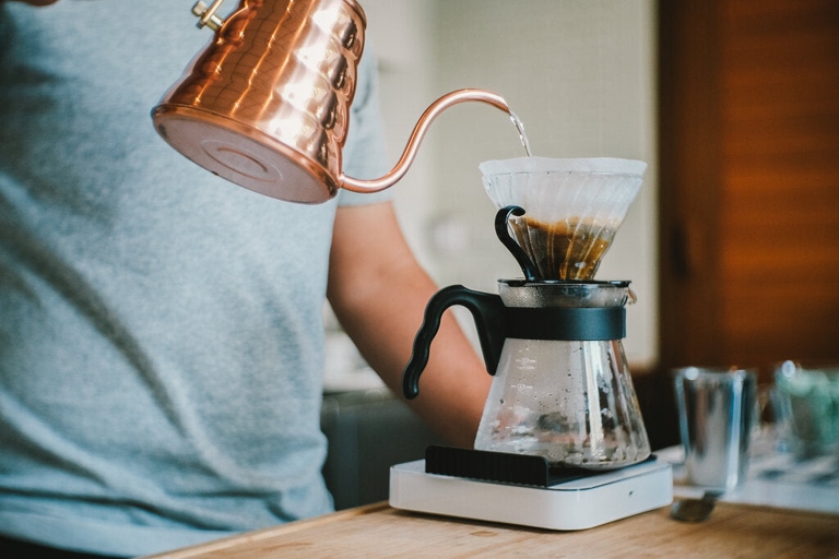 Pour over coffee is a type of coffee brewing method that involves pouring hot water over coffee grounds that are held in a filter.