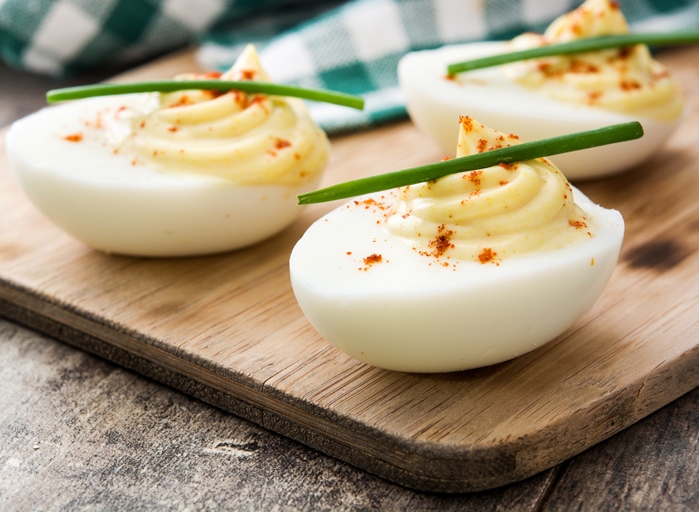 The best way to serve deviled eggs is to add mayonnaise to the yolks to make them thicker.