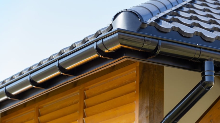The most common solution to a vibrating downspout is to simply re-secure it to the gutter with screws or hangers.