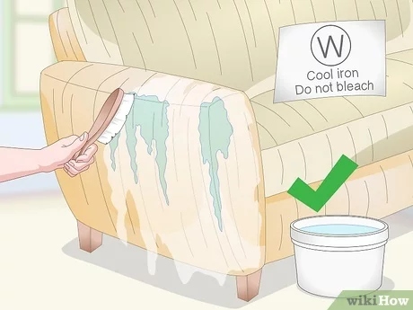 To remove a couch stain, mix two parts water with one part dish soap and apply it to the stain with a clean cloth.