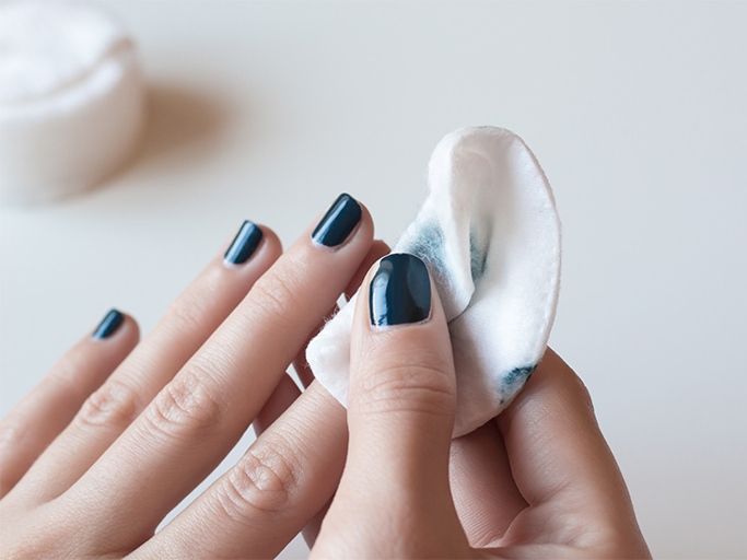 To remove oil-based paint from under your fingernails, use a cotton ball soaked in nail polish remover.