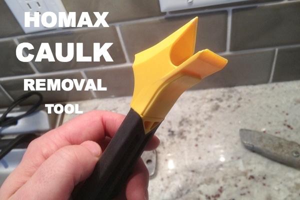 To remove silicone caulk from stainless steel, first use a utility knife to score the caulk.