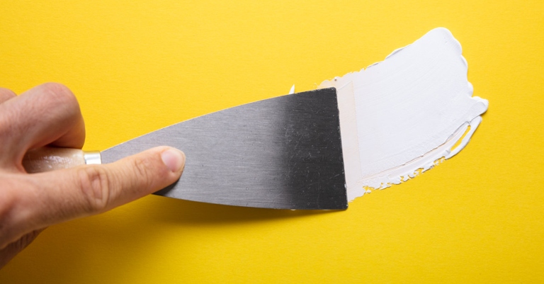 Use a utility knife to cut the old corner bead flush with the drywall.